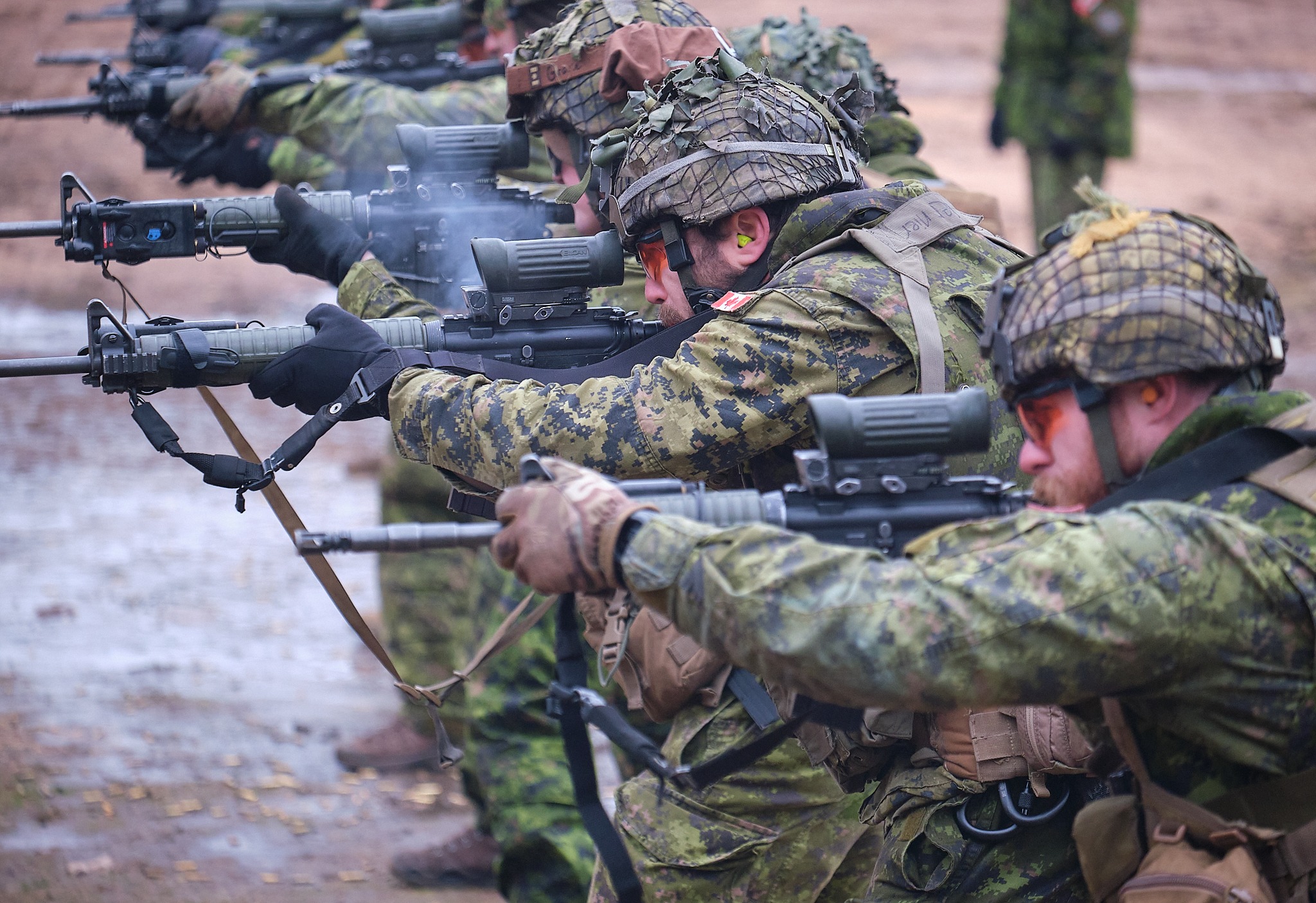 Canadian troops firing C7 rifles