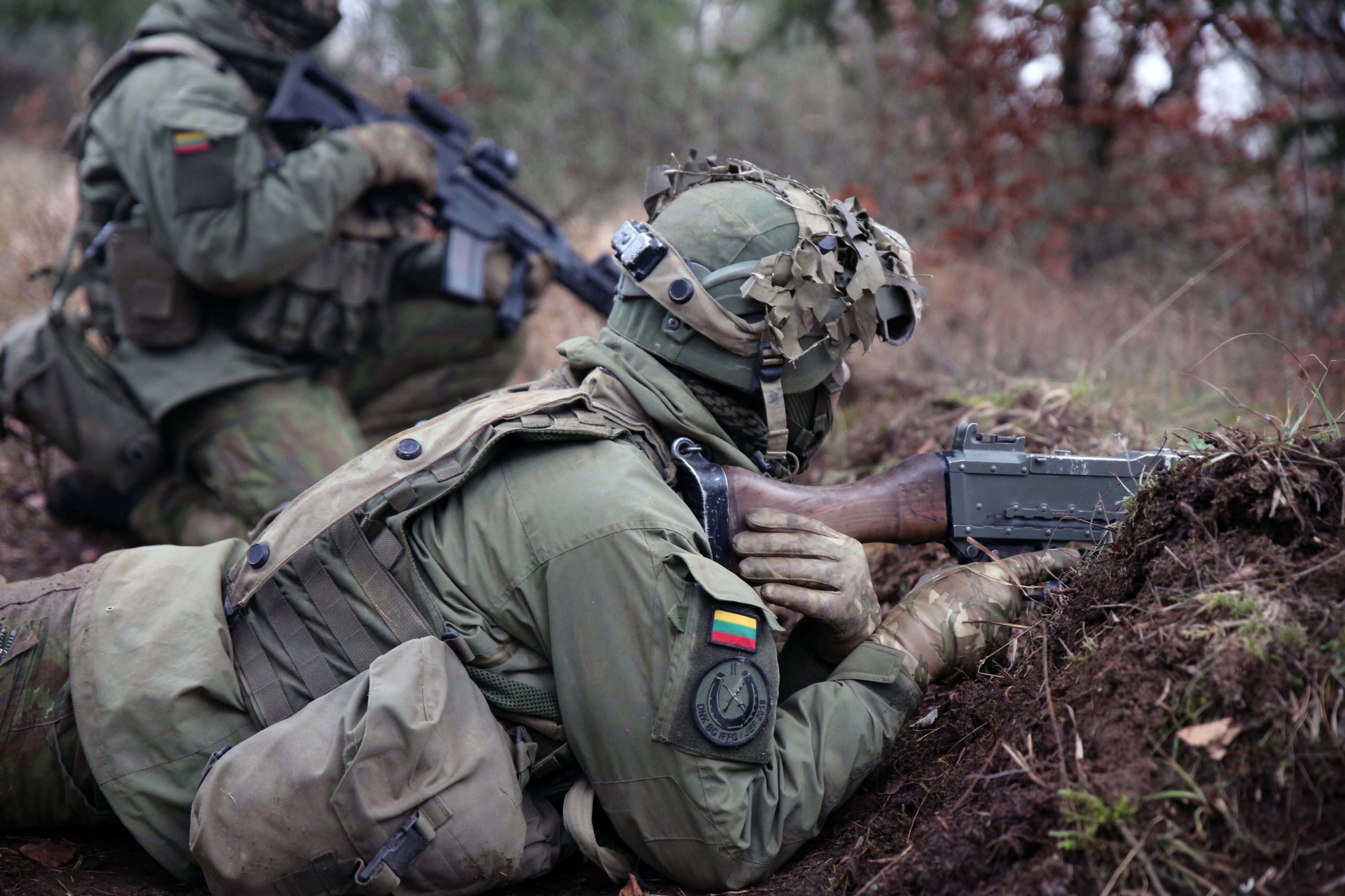 Lithuanian troops defend their position versus opposing forces during a combat exercise.