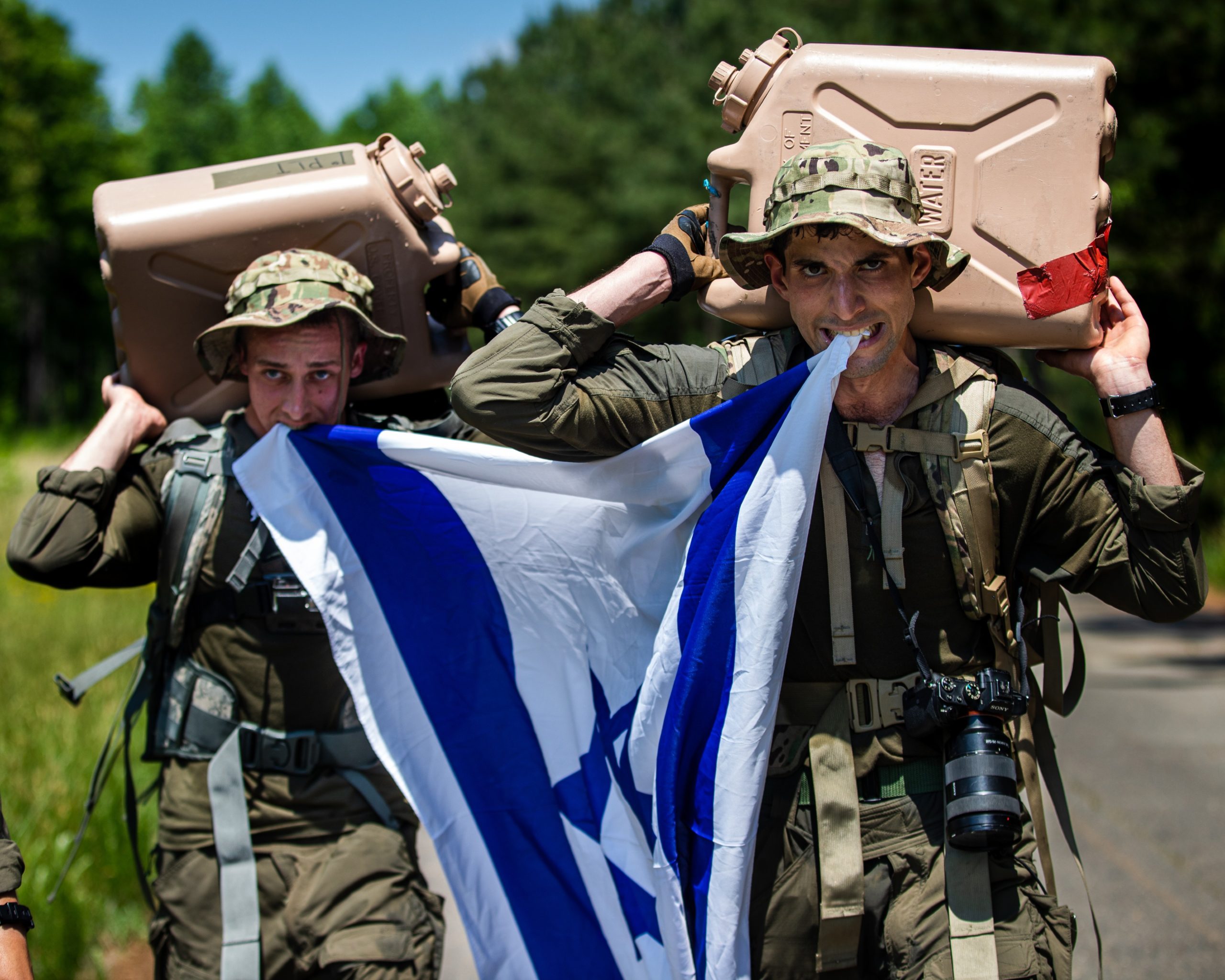 Israel Defense Forces Sgt. Yuval Chen and Sgt. Daniel Yastrijemski, visual information specialists assigned to Israel Defense Forces Combat Camera Unit, participate in 