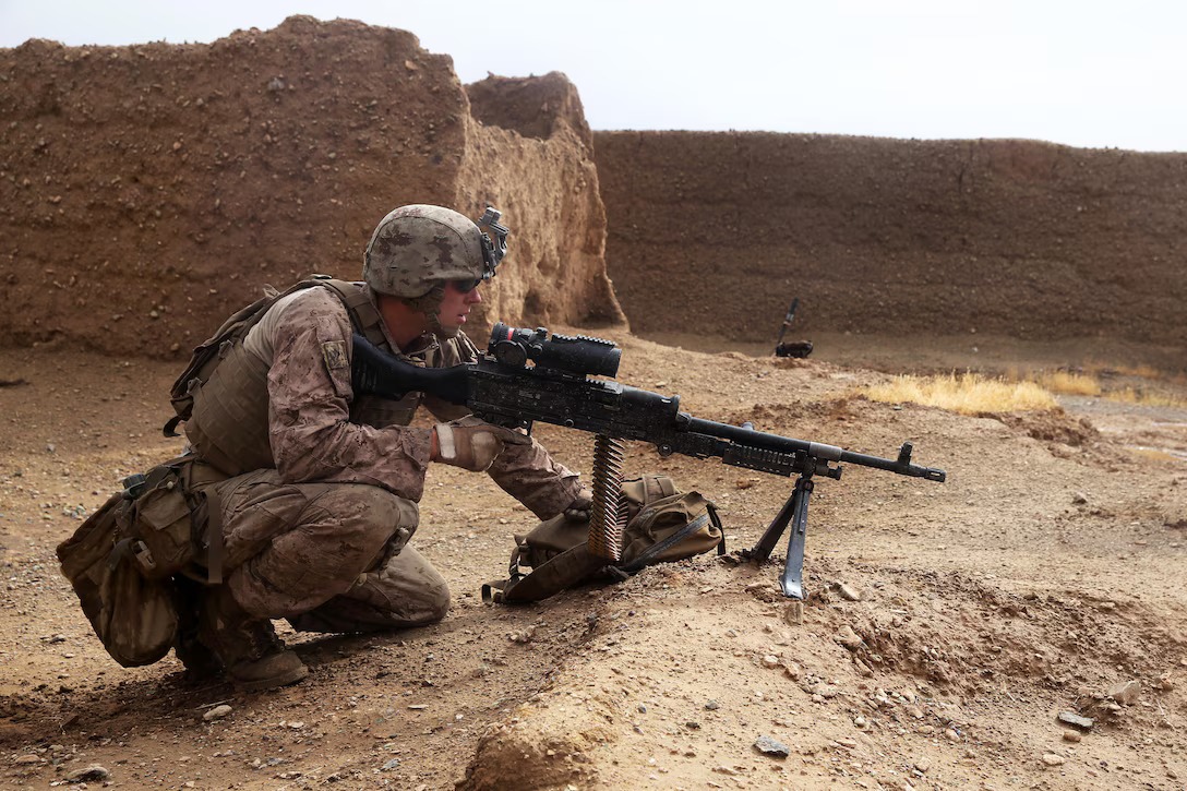 A soldier provides security with an M240B medium machine gun during a mission in Afghanistan.