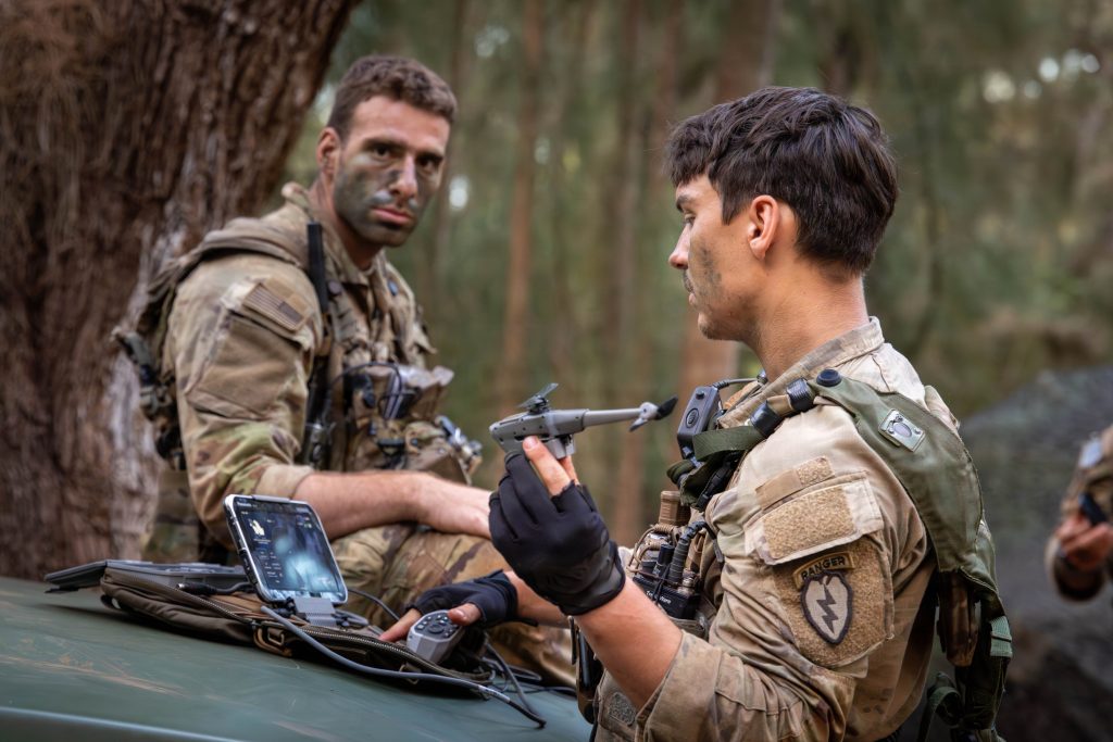 A US Army Soldier assigned to 25th Infantry Division launches a Black Hornet 4 Personal Reconnaissance System