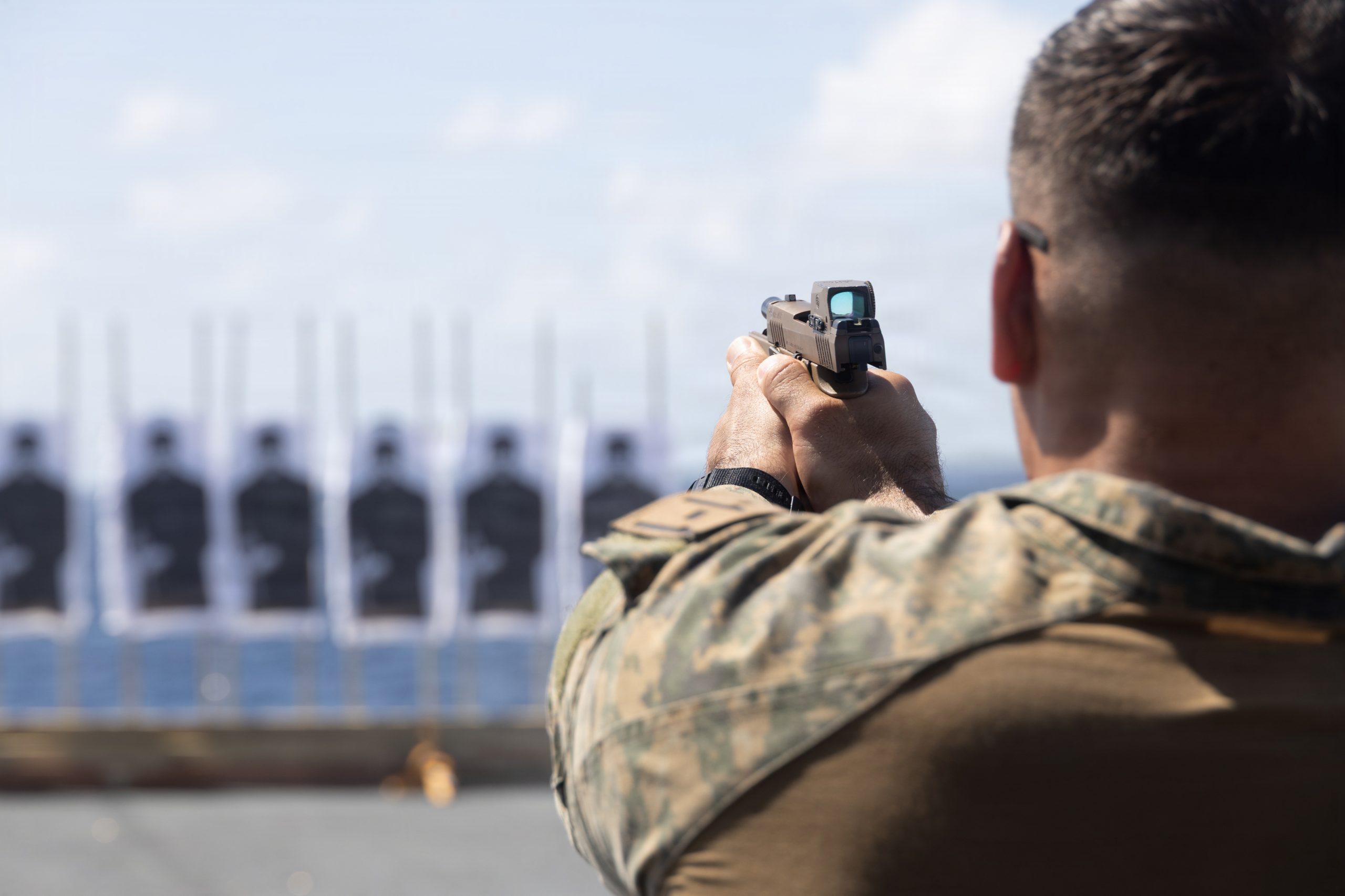A U.S. Marine with Maritime Special Purpose Force, 22nd Marine Expeditionary Unit (Special Operations Capable), fires an M18 pistol during a qualification range aboard San Antonio-class amphibious transport dock USS Fort Lauderdale (LPD 28), while underway in the Caribbean Sea, Feb. 22, 2026. U.S. military forces are deployed to the Caribbean in support of the U.S. Southern Command mission, Department of War-directed operations, and the president’s priorities to disrupt illicit drug trafficking and protect the homeland. (U.S. Marine Corps photo)