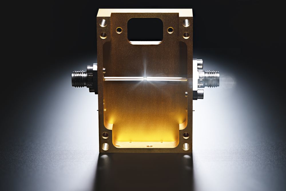 Gold-toned microelectronic component used in diamond-based semiconductor research, part of Northrop’s effort to power advanced microchips.