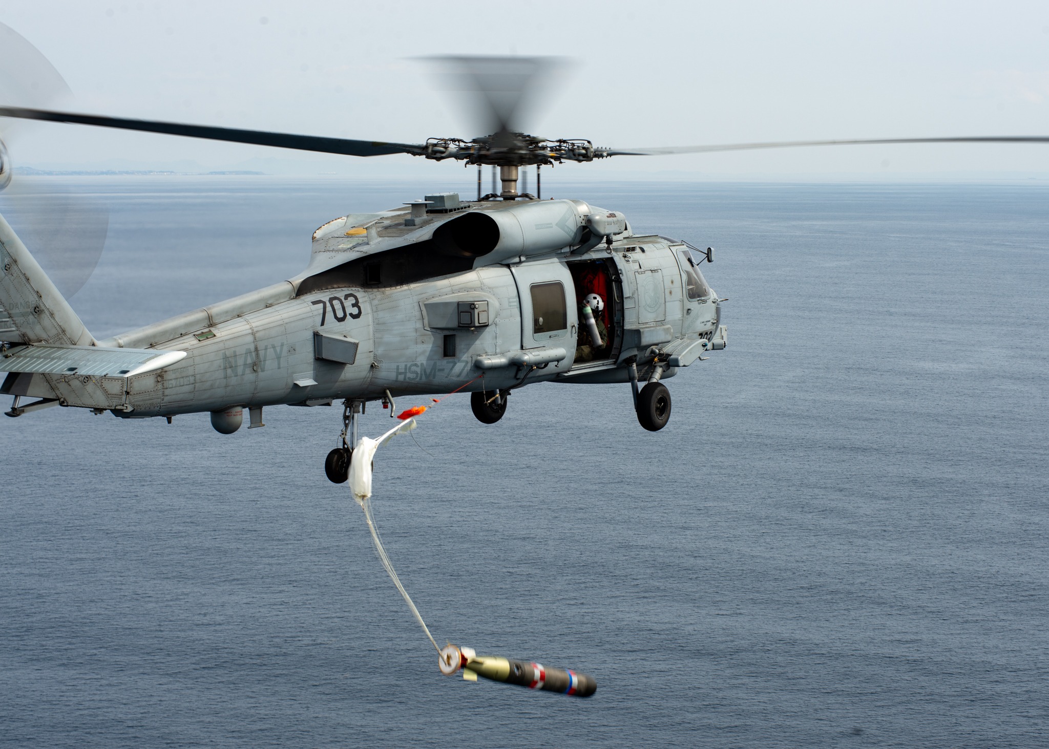 An MH-60R Seahawk drops a practice Mk 54 torpedo during a torpedo exercise