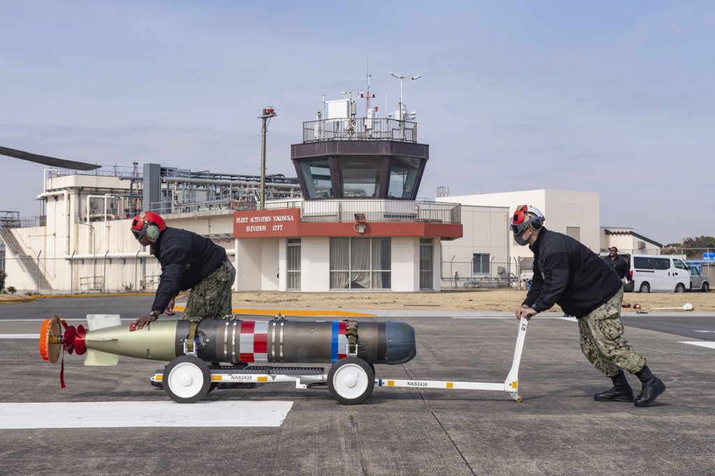 Sailors assigned to the “Saberhawks” of Helicopter Maritime Strike Squadron (HSM) 77 transport a MK 54 Lightweight Torpedo