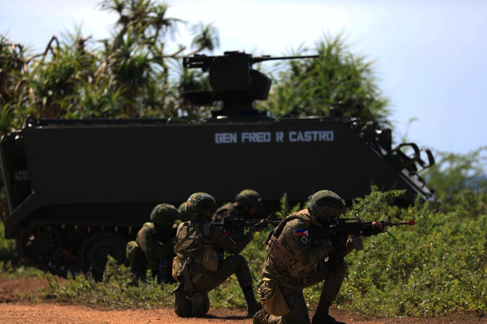 Dismounted infantry elements and Armored Infantry Fighting Vehicles defend the coastal position during the Littoral Defense Live Fire Exercise in Burgos, Pangasinan on March 9, 2026.