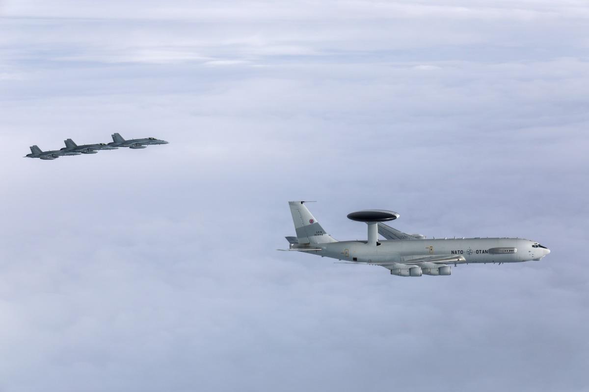 The NATO AWACS flies alongside Finnish F/A18s during a milestone mission in Finnish airspace. The mission, under Eastern Sentry and Arctic Sentry, provided critical long-range radar surveillance for the Alliance.