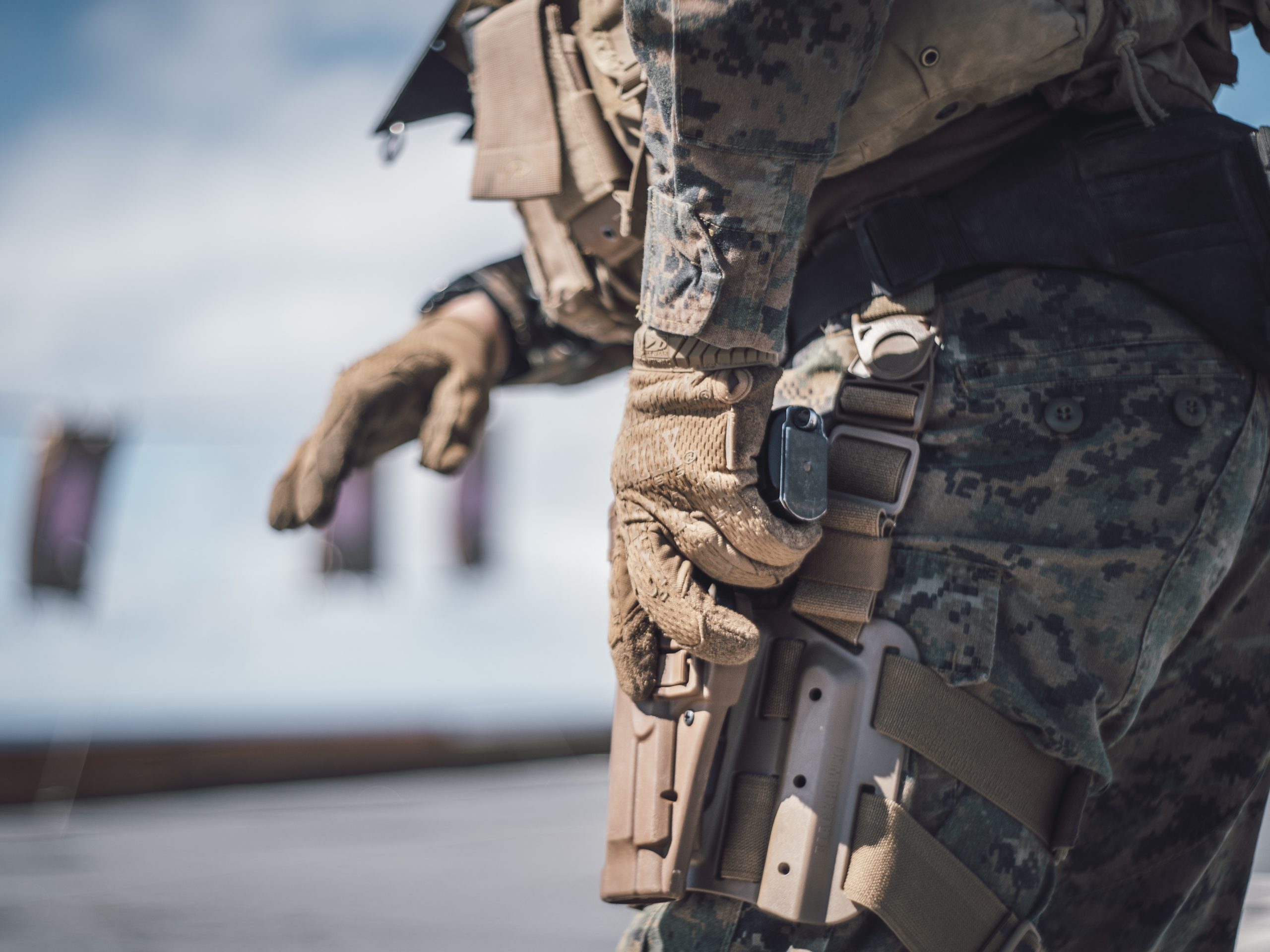 191110-M-HB658-2561 PACIFIC OCEAN (Nov. 10, 2019) U.S. Marine Corps 1st Lt. Luke Boyd, the combined anti-armor team platoon commander with Weapons Company, Battalion Landing Team 3/5, 11th Marine Expeditionary Unit (MEU), draws an M9 pistol during a small arms range aboard the San Antonio-class amphibious transport dock ship USS John P. Murtha (LPD 26). The Marines and Sailors of the 11th MEU are conducting routine operations as part of the Boxer Amphibious Ready Group in the eastern Pacific Ocean. (U.S. Marine Corps photo by Staff Sgt. Donald Holbert)