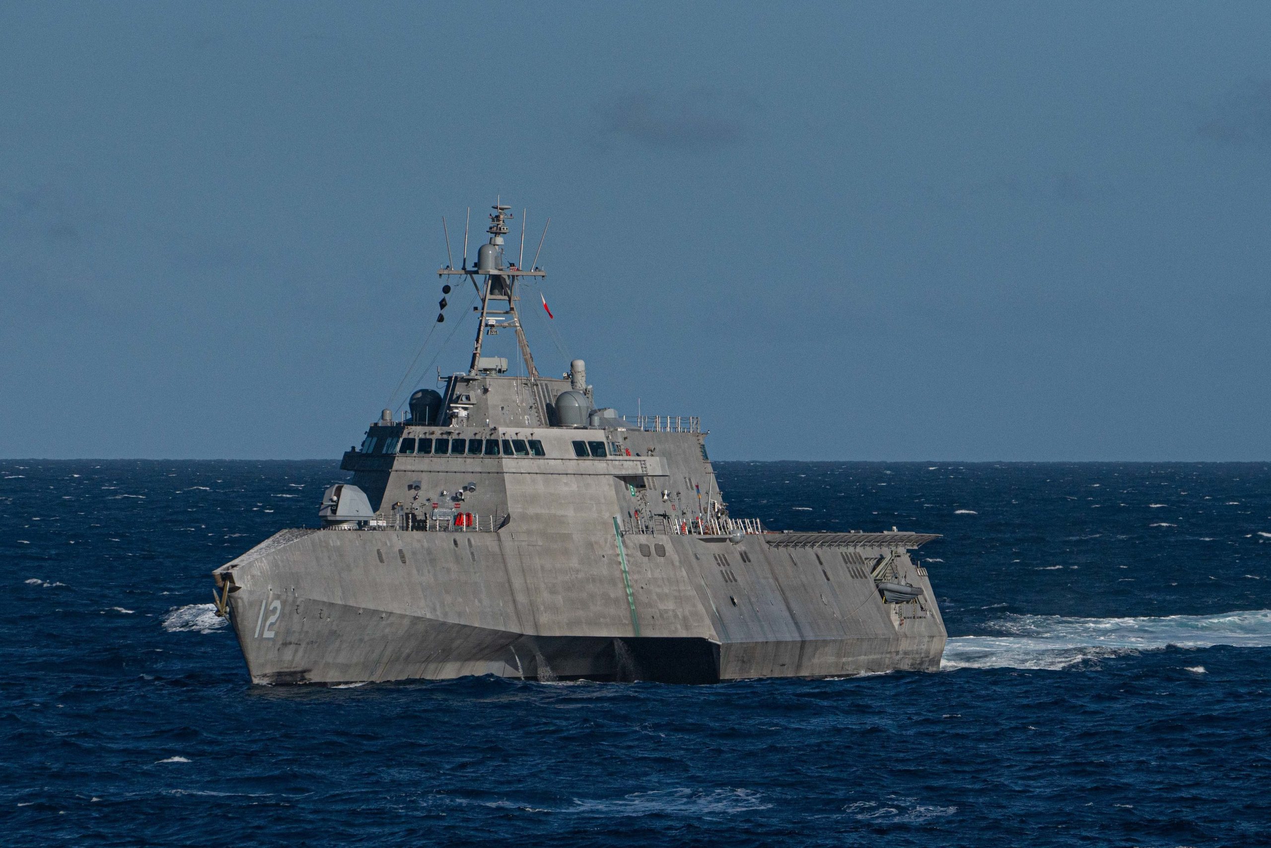 The Independence Class littoral combat ship USS Omaha (LCS 12) transits the Pacific Ocean during a Nimitz Carrier Strike Group (CSG) composite training unit exercise (COMPTUEX). COMPTUEX is an intensive exercise designed to fully integrate units of the CSG, while testing its ability as a whole to carry out sustained combat operations from the sea. (U.S. Navy photo by Mass Communication Specialist 3rd Class Andrew Langholf/RELEASED)