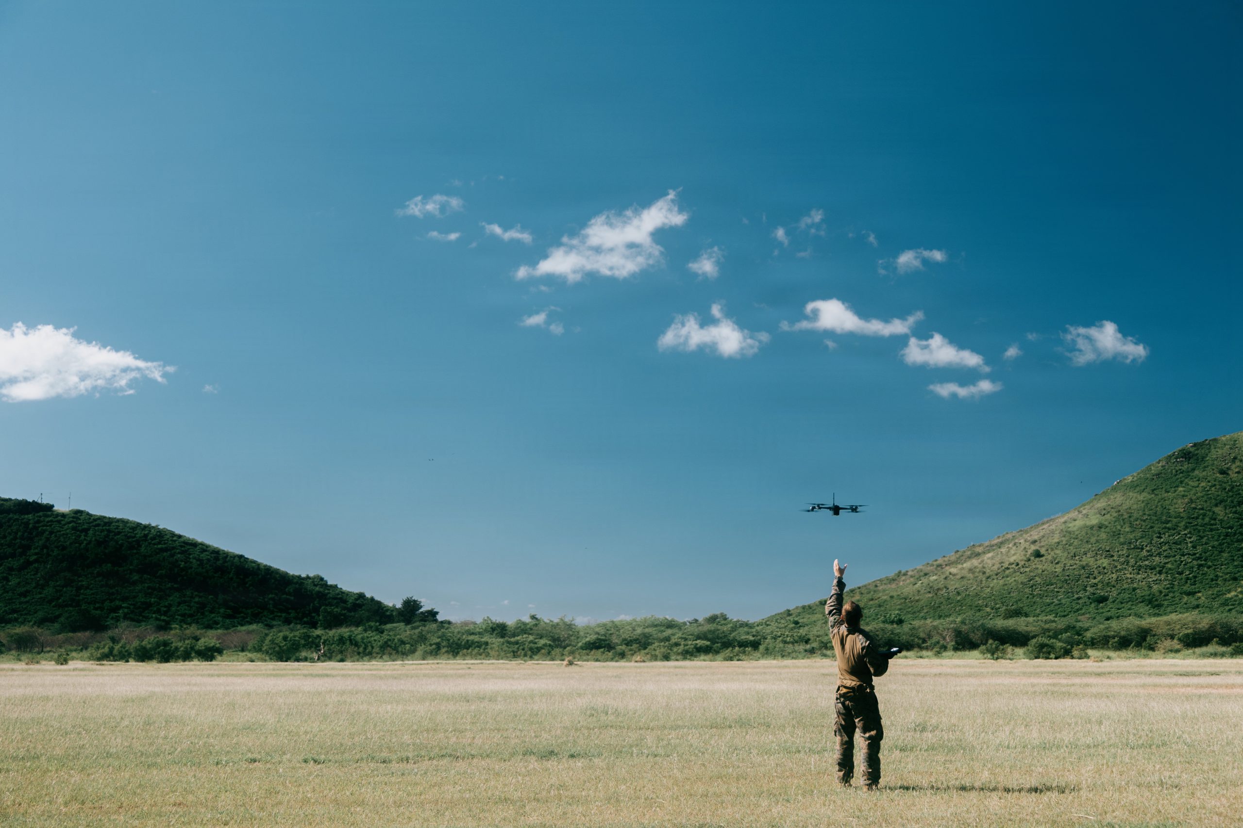 A U.S. Marine Corps mortarman with Kilo Company, Battalion Landing Team 3/6, 22nd Marine Expeditionary Unit (Special Operations Capable), launches a SkyDio X2D small unmanned aircraft system during attack drone training on Camp Santiago, Puerto Rico, Nov. 21, 2025. 22nd MEU(SOC) Marines are being trained and certified by the 2d Marine Division and the Marine Corps Attack Drone Team on first-person view drone systems to enhance combat readiness. U.S. military forces are deployed to the Caribbean in support of the U.S. Southern Command mission, Department of War-directed operations, and the president's priorities to disrupt illicit drug trafficking and protect the homeland. (U.S. Marine Corps photo)