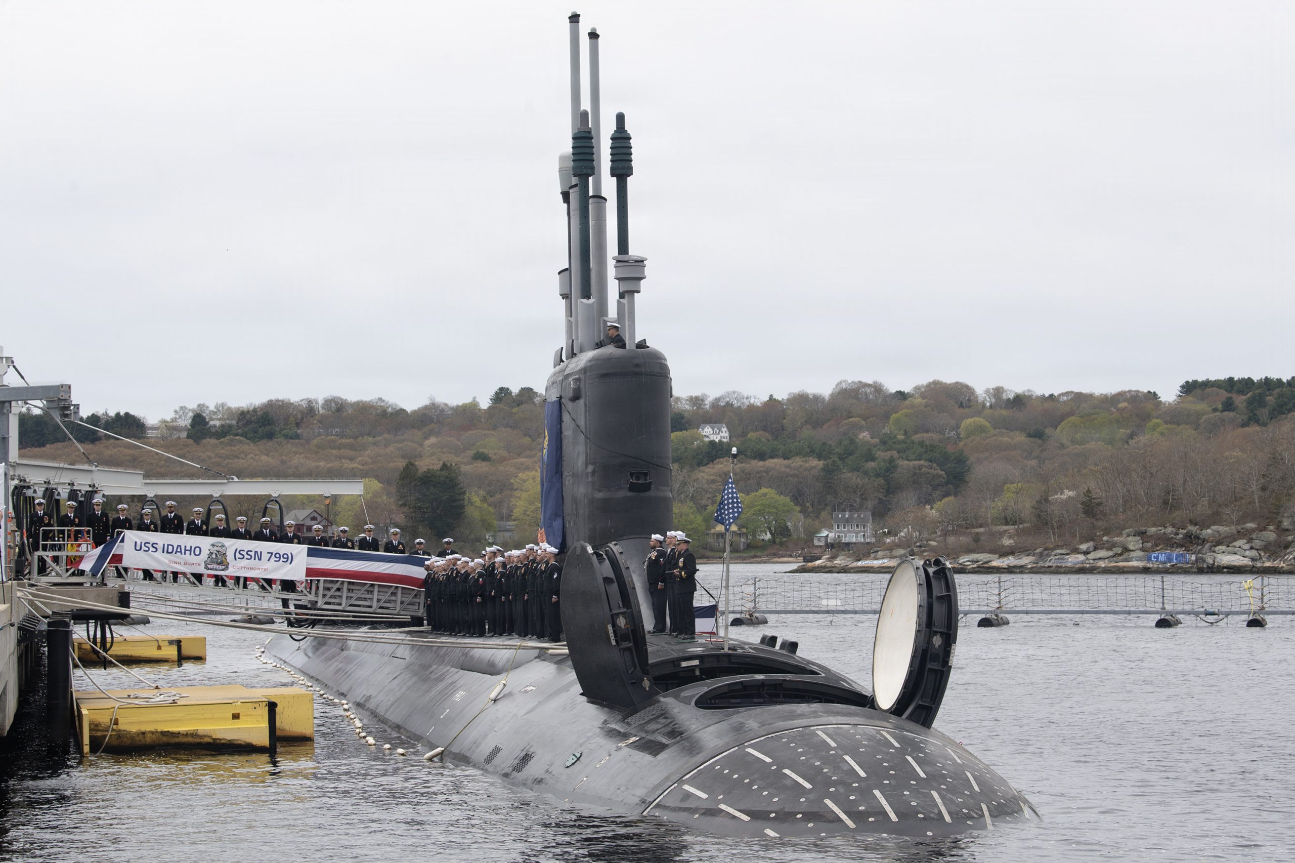 260425-N-UM744-1007- Sailors assigned to the Virginia-class fast attack submarine USS Idaho (SSN 799) man the rails during a commissioning ceremony at Naval Submarine Base New London in Groton, Conn. on April 25, 2026. SSN 799, the fifth U.S. Navy vessel to be named for “The Gem State”, operates under Submarine Squadron (SUBRON) FOUR, whose primary mission is to provide attack submarines that are ready, willing, and able to meet the unique challenges of undersea combat and deployed operations in unforgiving environments across the globe. (U.S. Navy photo by John Narewski)