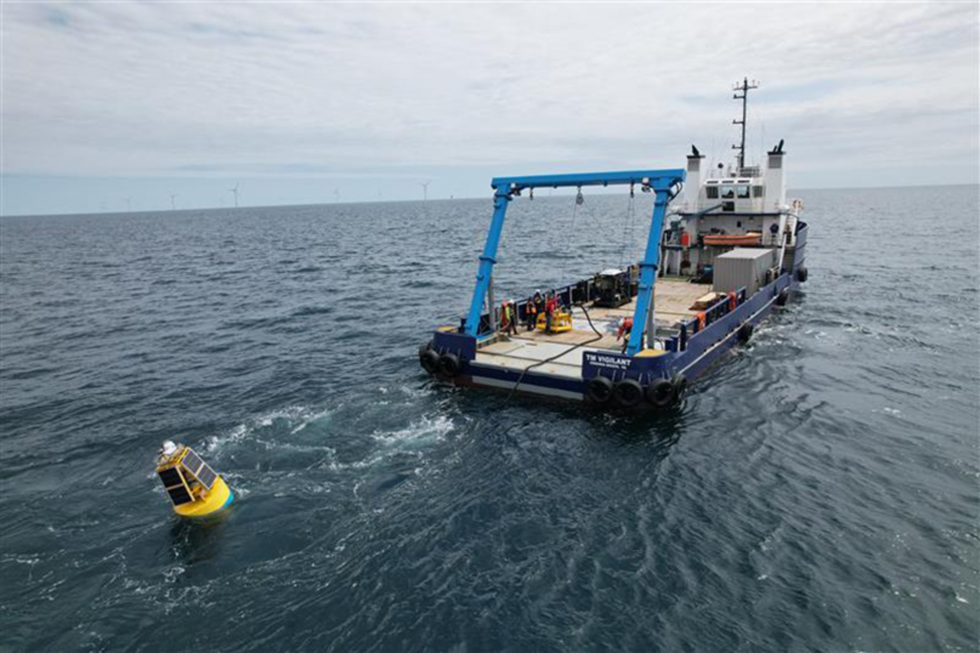 A boat towing the SeaPicket undersea surveillance system