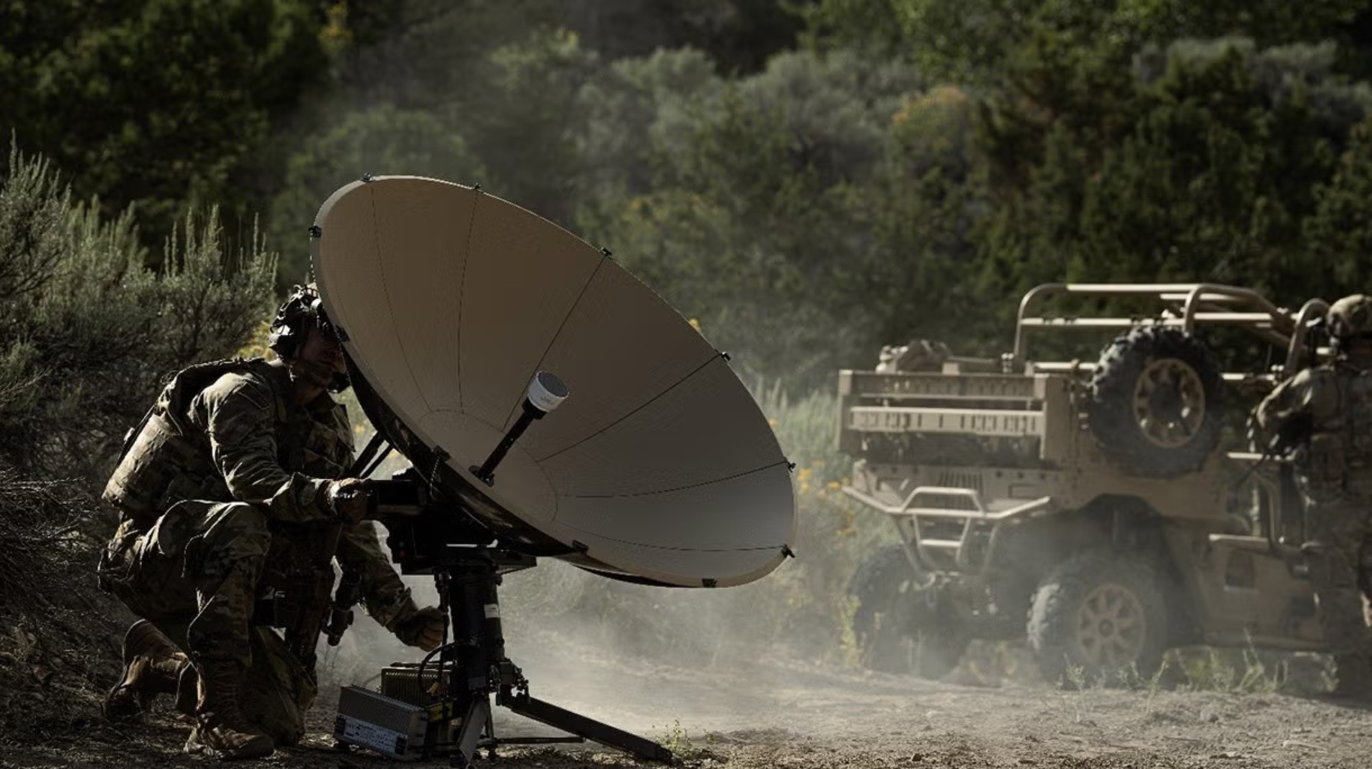 Soldier preparing a deployable satellite