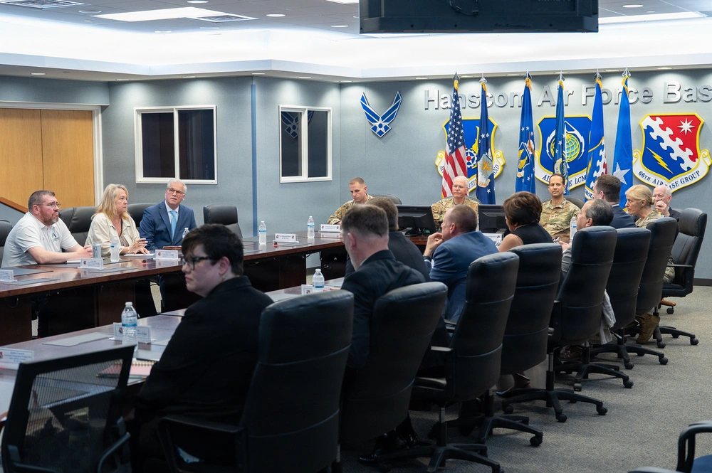 Military and civilian personnel participate in a leadership meeting at Hanscom Air Force Base during a visit by Air Force Materiel Command officials in May 2026.