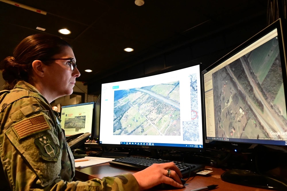 Tennessee Air National Guard personnel analyzes imagery from commercial satellites and open source websites