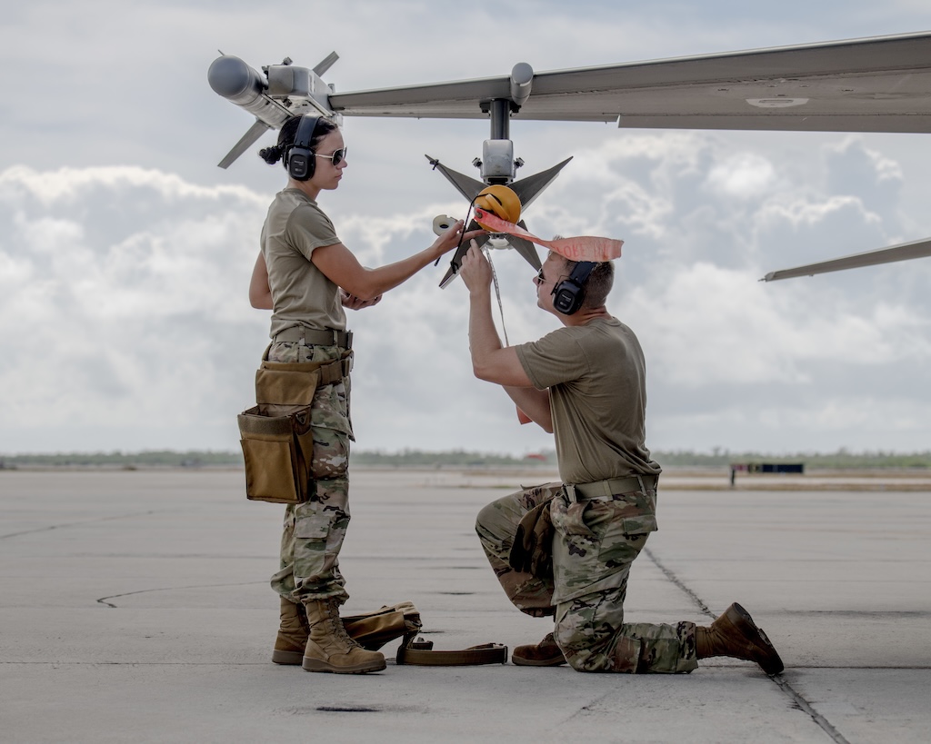 aircraft armament specialists service the argon in an AIM-9 Sidewinder missile on an F-16 Fighting Falcon