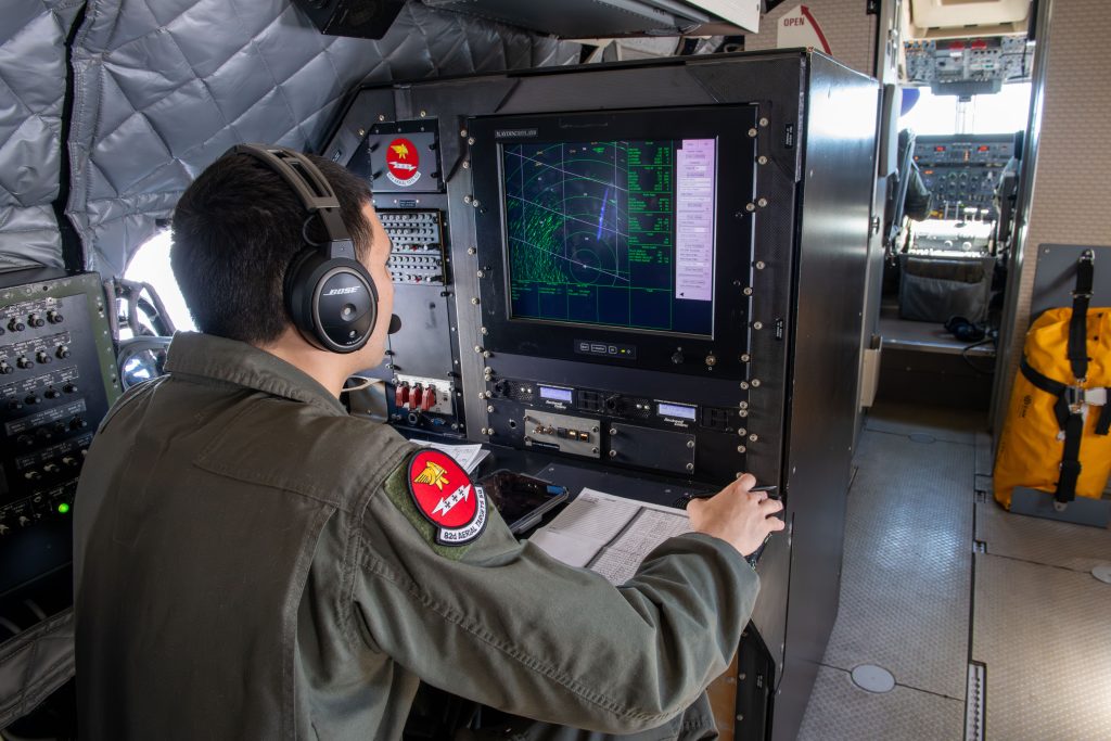 US Air Force Senior Airman, an E9-A Widget mission systems operator, monitors a sea surveillance radar