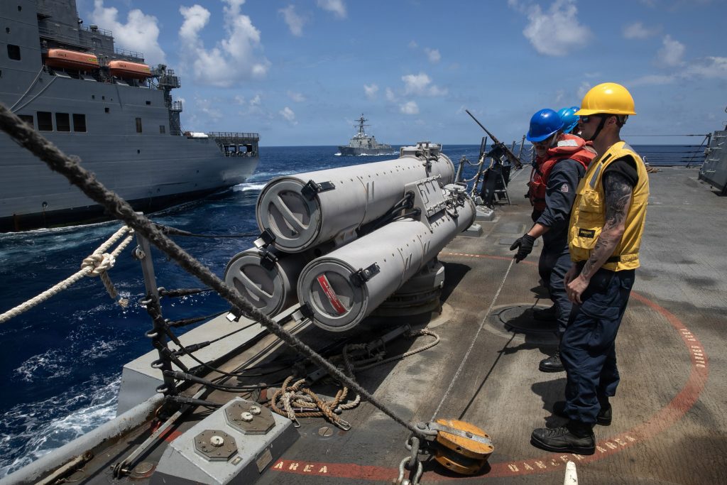 U.S. Sailors heave on a tending line aboard the Arleigh Burke-class guided-missile destroyer USS Wayne E. Meyer (DDG 108) during a replenishment-at-sea with the John Lewis-class fleet replenishment oiler USNS John Lewis (T-AO 205)