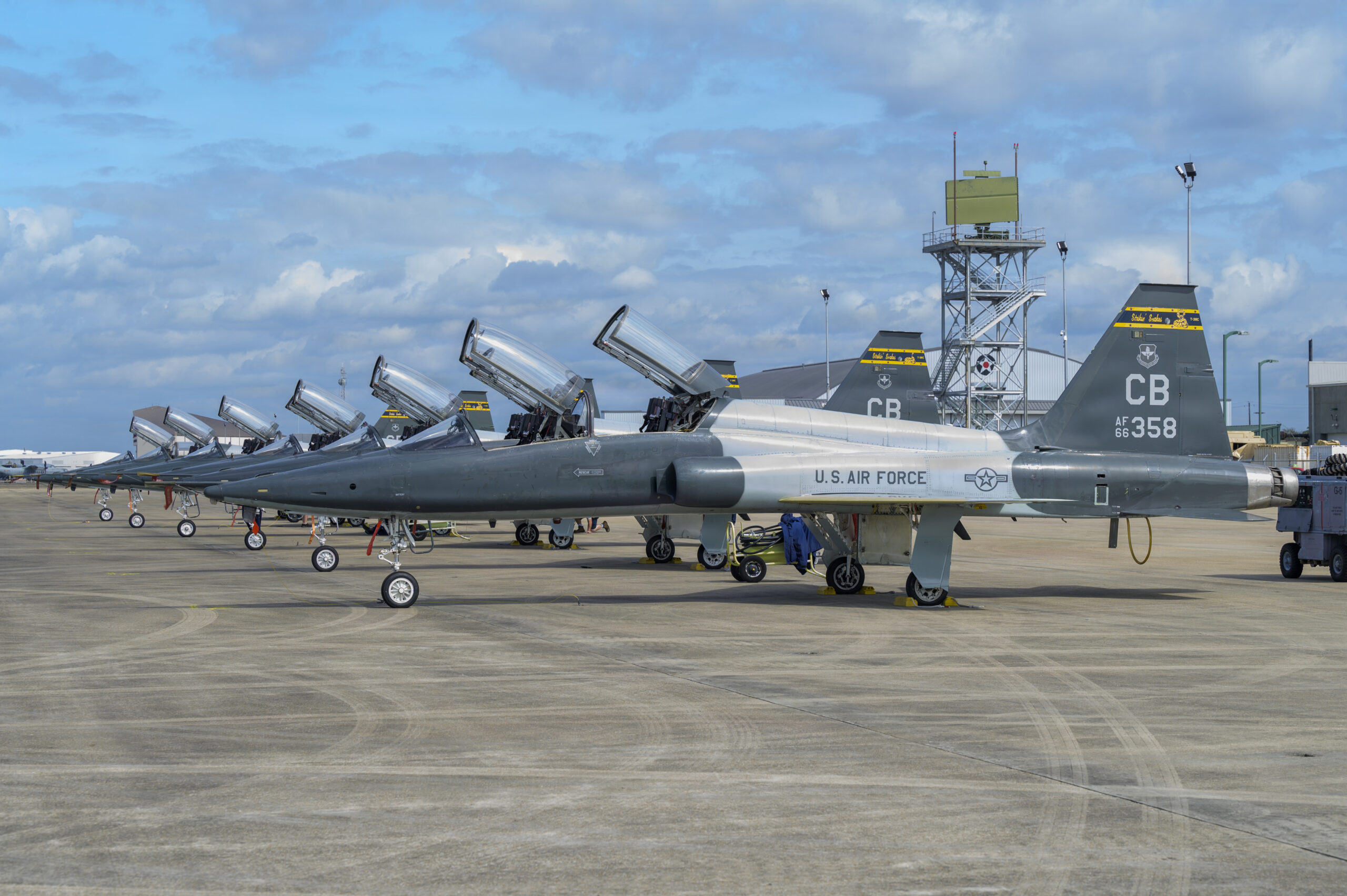 Six U.S. Air Force T-38 Talon aircraft are parked on the flightline during exercise Sentry South 26-2, Gulfport, Mississippi, Feb. 25, 2026. Sentry South 26-2 is a large force employment exercise focused on major combat operations and joint maritime opportunities in a contested or degraded operational environment. Sentry South 26-2 applies joint and combined warfighting doctrine against realistic and robust enemy integrated threat systems, all while under safe and controlled conditions. (U.S. Air National Guard photo by Staff Sgt. Dylan McCrink)