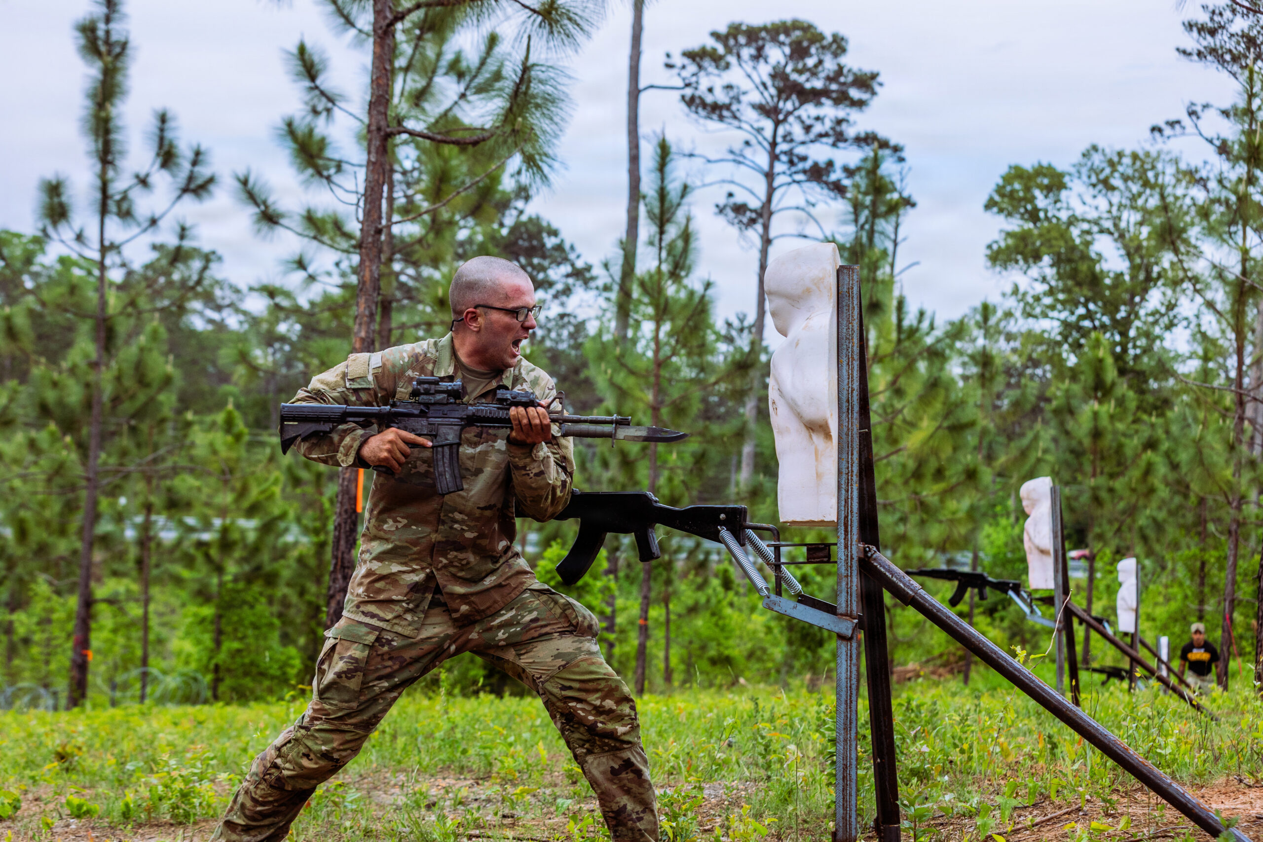 A U.S. Army Ranger Course student from Class 06-26 attacks an upright enemy target on the new Bayonet Assault Course during the Ranger Assessment Phase (RAP) April 21, 2026, at Fort Benning, Georgia. The quarter-mile course is a recent addition to the Malvesti Obstacle Course and was designed to rapidly instill grit and violence of action, preparing Rangers to close with and destroy the enemy in contested environments where modern technology may fail. (U.S. Army photo by Joey Rhodes II)