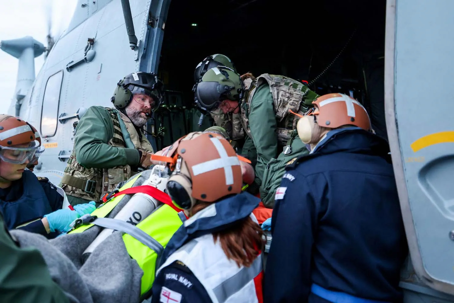 HMS Prince of Wales Maritime Medical Emergency Response Team (MMERT) performs medical response to a simulated injury aboard the HMS Duncan destroyer.
