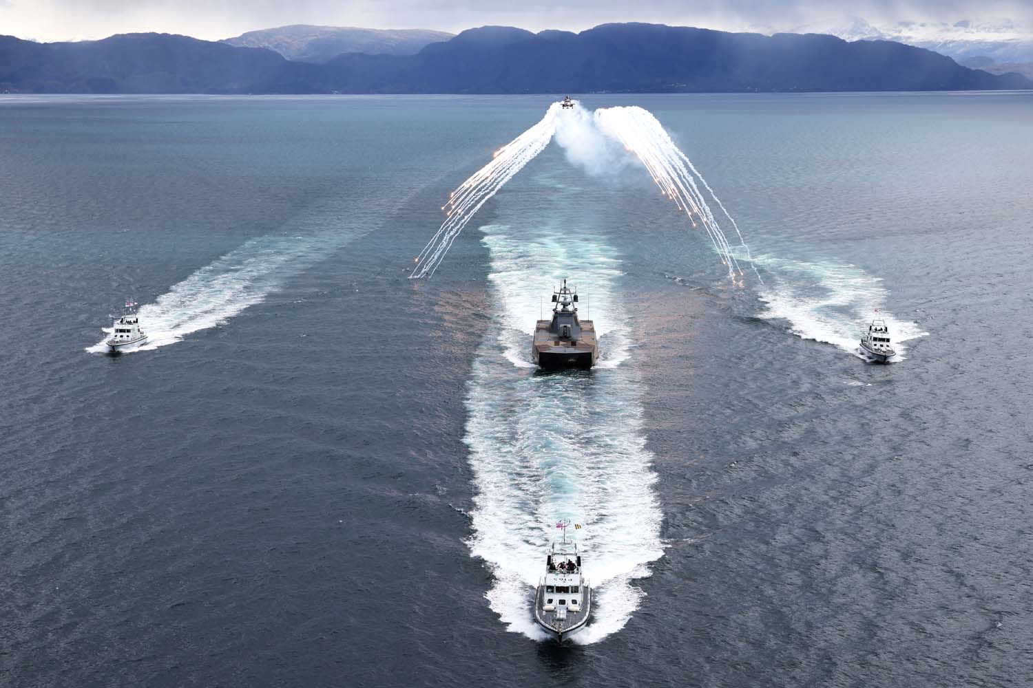 11 MAY 2026 - Wildcat HMA2s from 815 Naval Air Squadron conduct a photo exercise with P2000s and a Royal Norwegian Navy Skjold-class corvette, during Exercise Tamber Shield in Norway. Now in its fourth consecutive year, Tamber Shield continues to demonstrate the effectiveness of enhanced interoperability between the two maritime forces. For the first time, Puma surveillance drones from 700X NAS will also participate in the exercise, enabling the Fleet Air Arm to develop its crewed-uncrewed teaming (CUC-T) capability against small, agile threats.