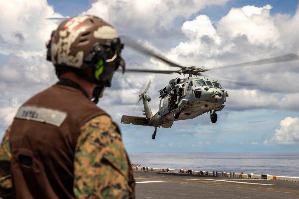 US Marines assigned to the 11th Marine Expeditionary Unit conduct flight operations aboard the USS Boxer in the Indian Ocean.