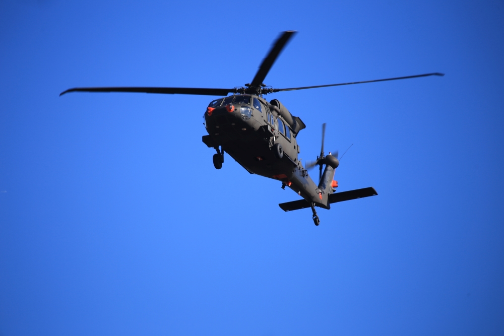 A UH-60M Army Helicopter conducting U.S. Army Phase I flight tests of Northrop Grumman’s ITDS, featuring the ATHENA sensor.