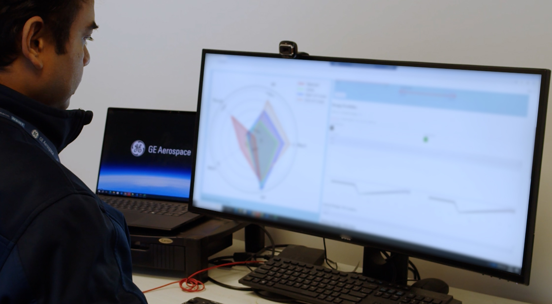 GE Aerospace researcher reviewing data from a generative AI application used to design and assess hypersonic ramjet engine concepts on a computer workstation. Photo: GE Aerospace