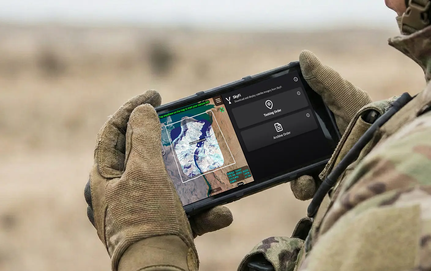 Soldier uses SkyFi device.